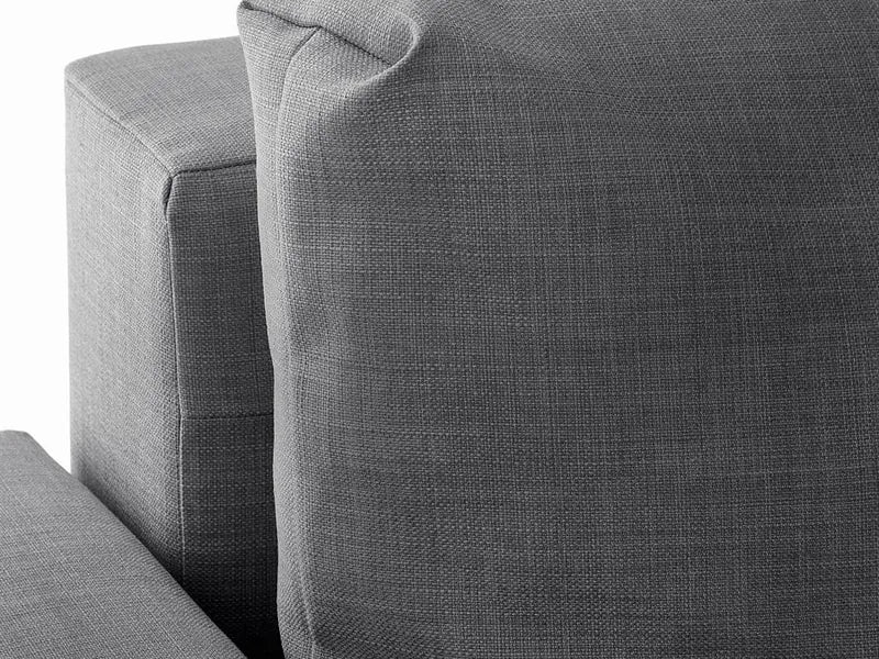 Close-up of a back cushion and the arm, showing the woven dark grey fabric