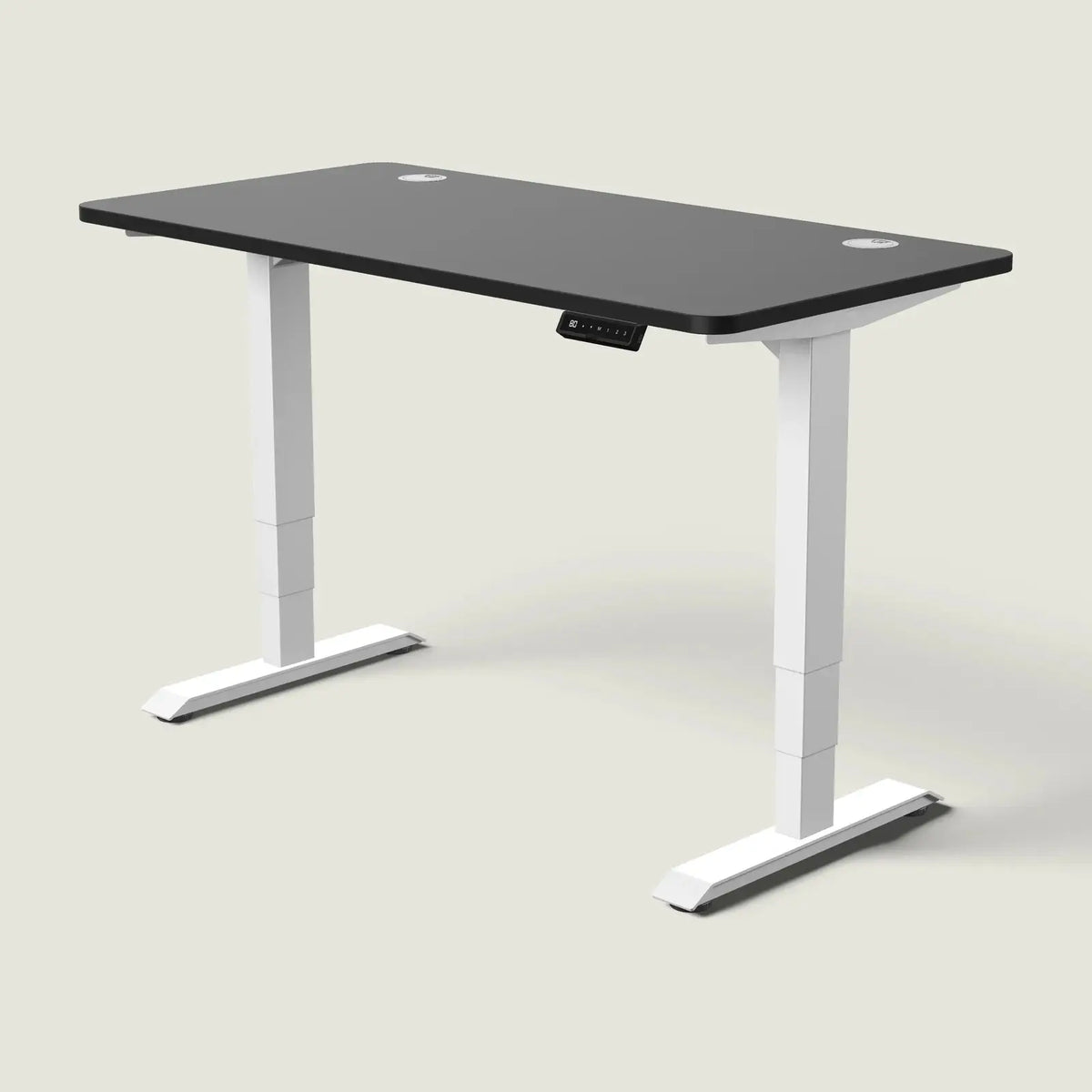 Electric standing desk, 140 × 70 cm, white frame and black top, with the memory handset under the front edge, on a pale grey background